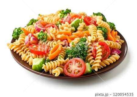 Fresh garden rotini pasta salad with colorful vegetables served on a brown plate against a white 120054535