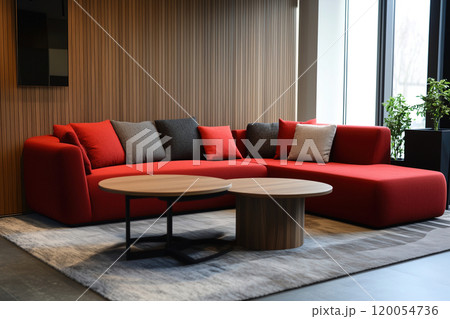 Modern red sectional sofa with contrasting cushions and round coffee table in a stylish living room 120054736