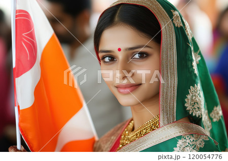A young woman in traditional attire proudly holds a flag during a cultural celebration in her A young woman in traditional attire proudly holds a flag during a cultural celebration in her 120054776