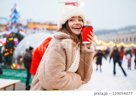 Woman enjoying winter moments. Festive Christmas fair, winter holidays concept. 120054877