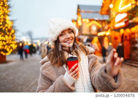 Woman enjoying winter moments. Festive Christmas fair, winter holidays concept. 120054878