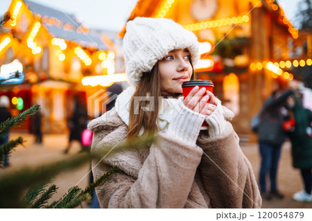 Woman enjoying winter moments. Festive Christmas fair, winter holidays concept. Woman enjoying winter moments. Festive Christmas fair, winter holidays concept. 120054879
