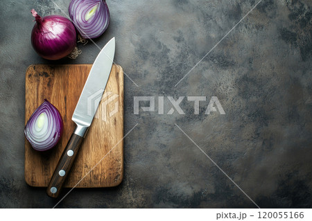 Chopping red onions on a wooden cutting board with a sharp knife in a modern kitchen setting Chopping red onions on a wooden cutting board with a sharp knife in a modern kitchen setting 120055166