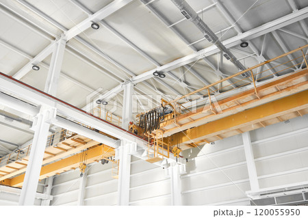 Overhead cranes inside industrial building 120055950