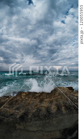 Sea waves break upon rocks Sea waves break upon rocks 120055955