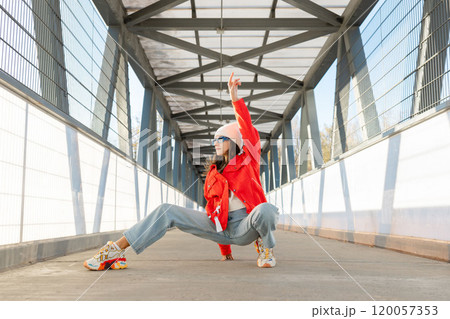 Happy beautiful woman walking and dancing outdoor. Young carefree girl enjoys the day and dancing Happy beautiful woman walking and dancing outdoor. Young carefree girl enjoys the day and dancing 120057353