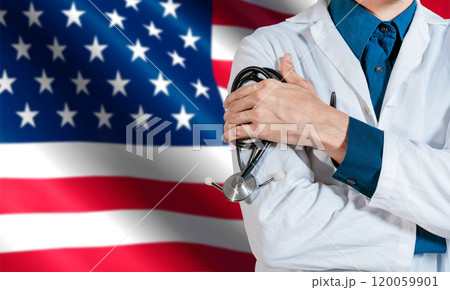 Doctor with stethoscope on USA flag. Health and care with the flag of United State. USA national health concept, Doctor arm holding stethoscope on USA flag 120059901
