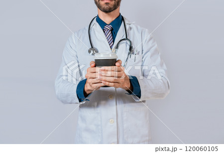 Doctor hands holding paper coffee. Doctor holding takeaway coffee on isolated background, Young doctor holding a coffee to go isolated Doctor hands holding paper coffee. Doctor holding takeaway coffee on isolated background, Young doctor holding a coffee to go isolated 120060105