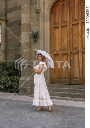 Woman Pregnant Dress Umbrella Standing in Front of Large Wooden Door in Old Building. 120065634