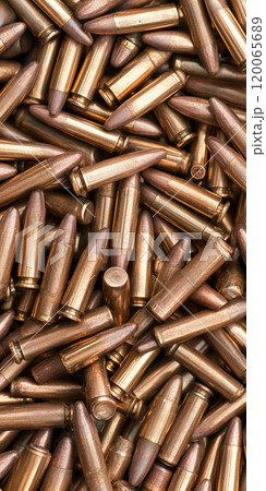 Ammunition background with metallic bullets in a pile for military and shooting themes, AI Generative 120065689