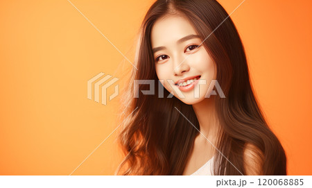 Portrait of smiling asian teenager girl orange background. 120068885