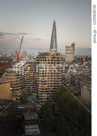 Aerial view, triptych Bankside apartments with The Shard Tower and Modern buildings in London with Beautiful sky background before sunset. Aerial view, triptych Bankside apartments with The Shard Tower and Modern buildings in London with Beautiful sky background before sunset. 120069036