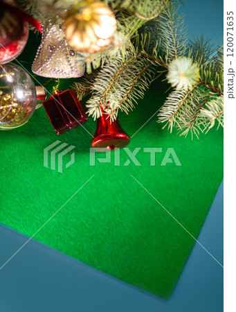 Christmas toys on the Christmas tree on a green background 120071635