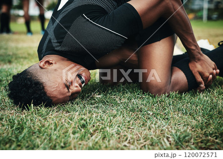What a bad mishap. Cropped shot of a handsome young rugby player suffering with an injury on the field. What a bad mishap. Cropped shot of a handsome young rugby player suffering with an injury on the field. 120072571
