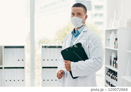 Lets get the world better again. Portrait of a confident young scientist wearing a mask in a modern laboratory. Lets get the world better again. Portrait of a confident young scientist wearing a mask in a modern laboratory. 120072668