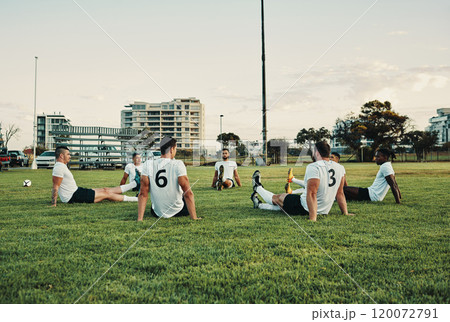 They gather here in the name of rugby. Full length shot of a group of young rugby players training on the field during the day. They gather here in the name of rugby. Full length shot of a group of young rugby players training on the field during the day. 120072791