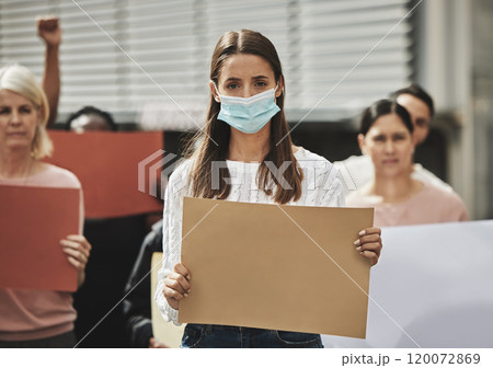 I will not be controlled. Cropped portrait of an attractive young woman wearing a mask while taking part in a political rally. 120072869