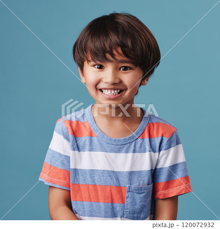 Japanese kid, boy and satisfied in studio background for fashion with fun, outfit and swag in Japan. Male person, child and smile or happy on portrait in confidence with trendy clothes and style 120072932