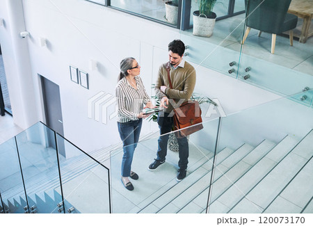Coming to an agreement on their big plans. Shot of two businesspeople using a digital tablet together in an office. Coming to an agreement on their big plans. Shot of two businesspeople using a digital tablet together in an office. 120073170