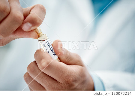 Just what the world has been waiting for. Cropped shot of a scientist opening an ampoule with 2019-nCov on it. 120073214