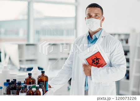 Theres a hero behind the mask. Portrait of a confident young scientist wearing a mask in a modern laboratory. Theres a hero behind the mask. Portrait of a confident young scientist wearing a mask in a modern laboratory. 120073226