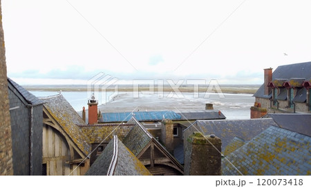 Rooftop view from Mont Saint Michel, Normandy, France overlooking tidal flats 120073418