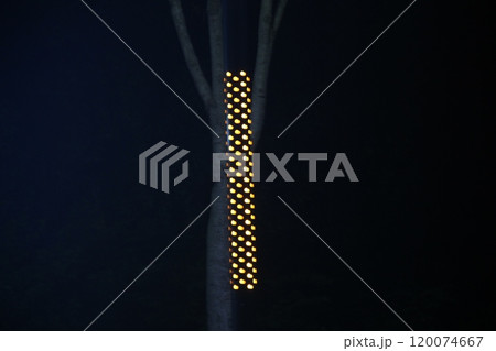 yellow lighting pole on black background 120074667