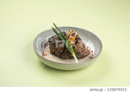Portion of baked beef shank with pepper sauce Portion of baked beef shank with pepper sauce 120074915