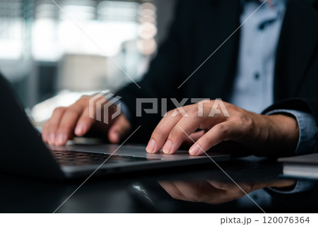 Close-up hand professional man typing keyboard on a modern laptop computer work at office, business and technology online efficiency. 120076364