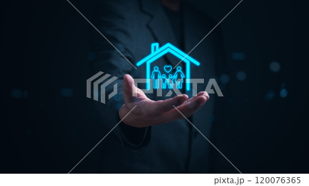 Hand presents a glowing hologram of a family within a house, symbolizing concepts of protection, security, and home insurance. estate real investment and financial business. 120076365