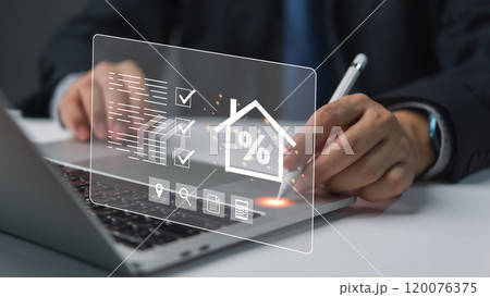 Businessman using laptop with holographic interface, displaying finance icons. Represents digital finance, innovation. Suitable for tech, financial services. Businessman using laptop with holographic interface, displaying finance icons. Represents digital finance, innovation. Suitable for tech, financial services. 120076375