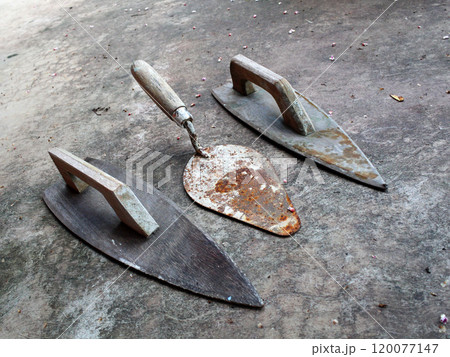 Wooden shoes and cement spoons 120077147