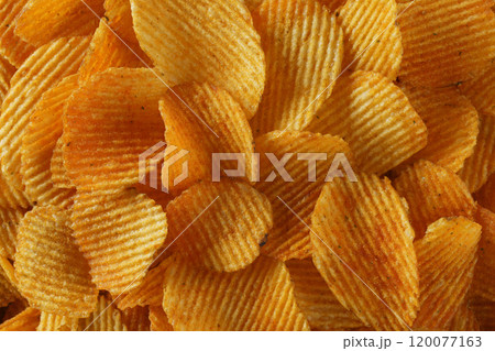 background ribbed potato chips with seasoning 120077163