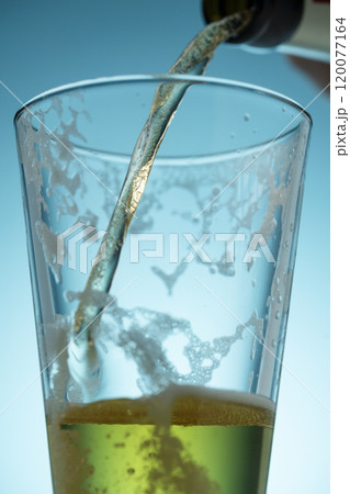 pouring beer, stream of light beer. 120077164