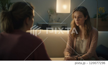 Visit to a psychologist. Woman sits on a couch and talks to a psychotherapist. Visit to a psychologist. Woman sits on a couch and talks to a psychotherapist. 120077296