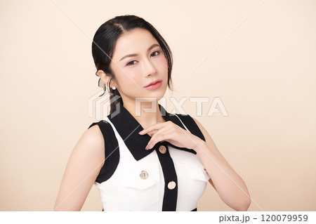 Beautiful young asian woman with clean fresh skin on beige background, Face care, Facial treatment, Cosmetology, beauty and spa, Asian women portrait. Beautiful young asian woman with clean fresh skin on beige background, Face care, Facial treatment, Cosmetology, beauty and spa, Asian women portrait. 120079959
