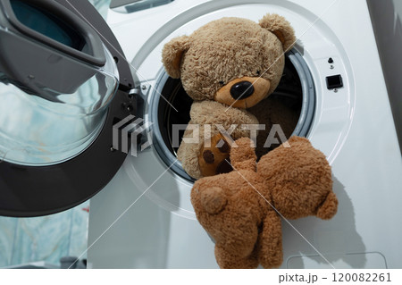 Adorable Teddy Bears Taking a Spin in the Washing Machine, Ready to Get Clean and Fresh 120082261