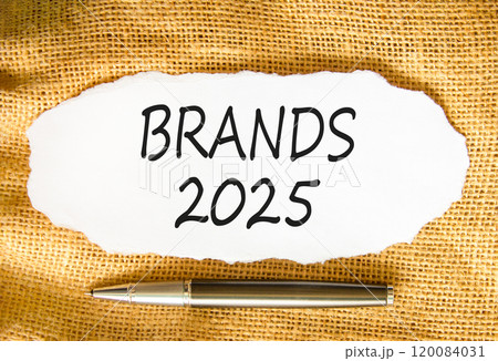 Planning brands 2025 new year symbol. Concept words Brands 2025 on beautiful white paper. Beautiful canvas background. Beautiful metallic pen. Business brands 2025 new year concept. Copy space. 120084031