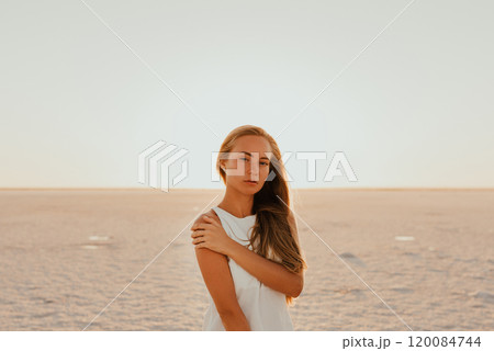 portrait of young tanned blonde European woman 120084744
