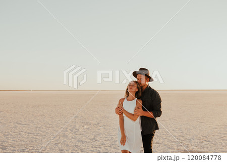 pink Lemurian lake, romantic photoshoot of young couple in love pink Lemurian lake, romantic photoshoot of young couple in love 120084778