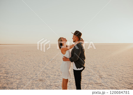 pink Lemurian lake, romantic photoshoot of young couple in love 120084781