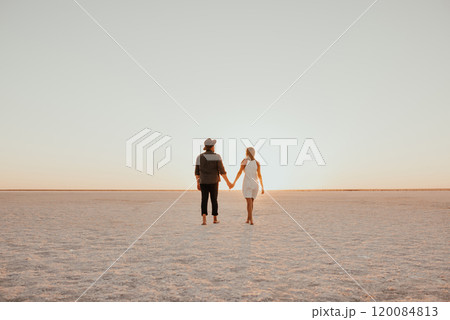 pink Lemurian lake, romantic photoshoot of young couple in love pink Lemurian lake, romantic photoshoot of young couple in love 120084813