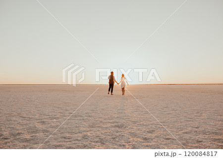 pink Lemurian lake, romantic photoshoot of young couple in love pink Lemurian lake, romantic photoshoot of young couple in love 120084817