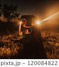 couple of young people background of car with headlights on 120084822