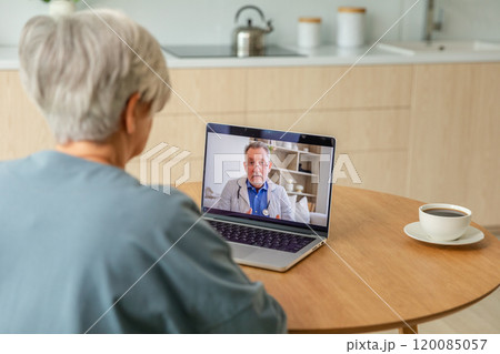 Senior man doctor expert examining older senior woman online. Old woman lady patient and doctor talk on video call have consultation with laptop. Medicine healthcare medical checkup. Online doctor Senior man doctor expert examining older senior woman online. Old woman lady patient and doctor talk on video call have consultation with laptop. Medicine healthcare medical checkup. Online doctor 120085057