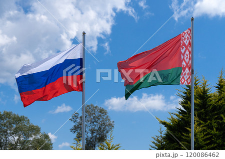 Flags of Russia and Belarus fluttering in the wind. 120086462