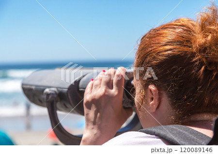 Woman tourist looking into the distance through 120089146