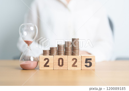 Happy New Year 2025 with hourglass and coins stack arrangement. Money Saving for Future Plan, Retirement fund, Pension, Investment, Wealth Business, Financial and countdown concepts 120089185