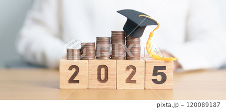 Happy New Year 2025 with Coins stack growing up and graduation hat. Money saving for Education, Scholarship, Student loan and debt and study future plan concept 120089187