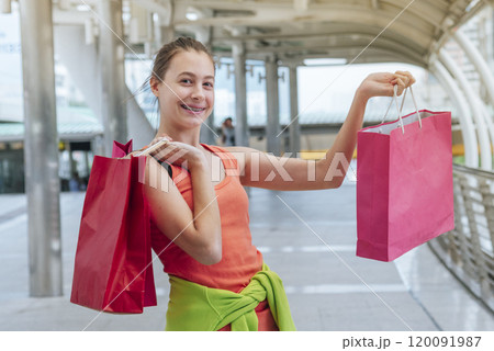 Shopaholic Women holding shopping bags ,money ,credit card person at shopping malls.Fashionable Woman love online website with sales tag on black Friday. E-commerce fashion digital marketing lifestyle Shopaholic Women holding shopping bags ,money ,credit card person at shopping malls.Fashionable Woman love online website with sales tag on black Friday. E-commerce fashion digital marketing lifestyle 120091987